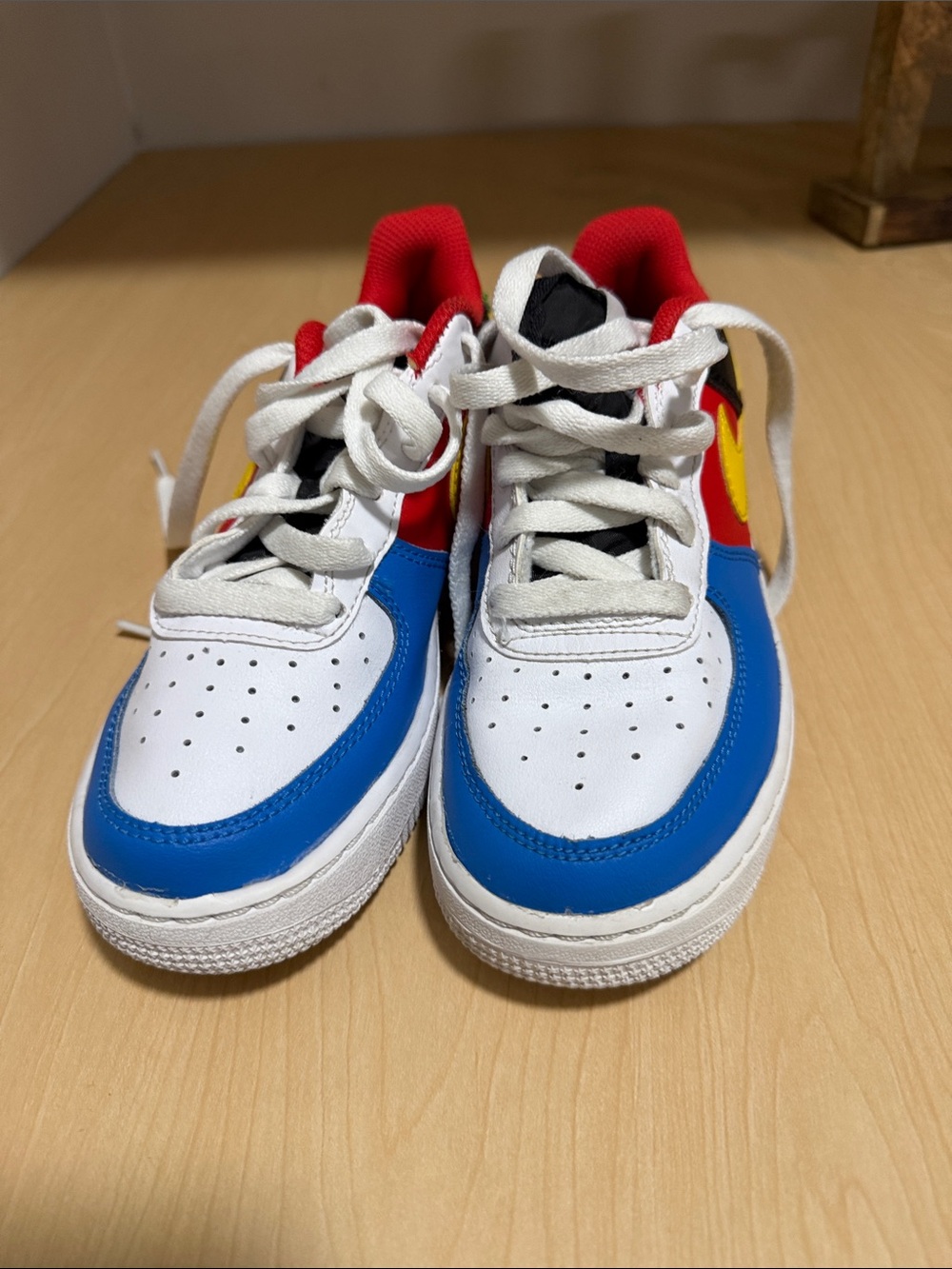 Nike Kids Colorblock Sneakers in White, Blue, Red & Yellow